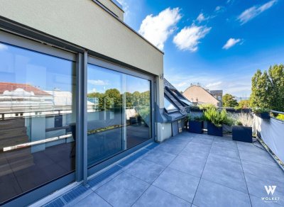 Exklusive 3-Zimmer-Dachgeschoss-Maisonette mit der Terrasse und Tiefgaragenplatz