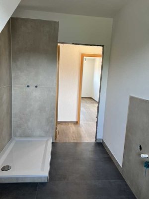 Neubauzustand - Sonnige 2-Zimmer-Wohnung mit Dachterrasse und Fernblick