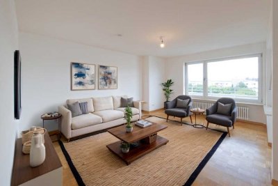 Lichtdurchflutetes Apartment mit großem Sonnenbalkon und Tiefgaragenstellplatz in zentraler Lage von