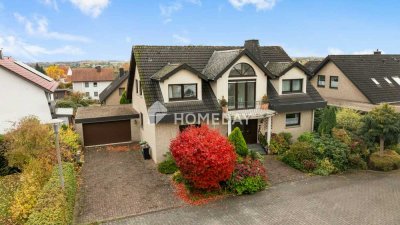 Familienfreundliches Einfamilienhaus mit großem Garten, Kamin und Doppelgarage
