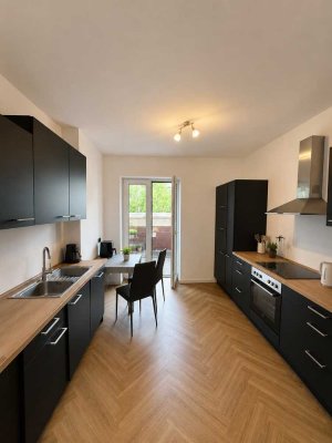 Modernes Wohnen im KfW-55-Haus – großzügige 1-Zimmer-Wohnung mit Balkon und Einbauküche