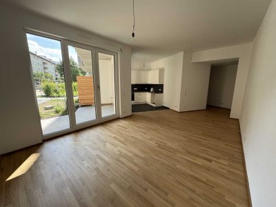 Neubau - Erstbezug: 2-Zimmer Wohnung mit Süd-Terrasse, EBK und TG Stellplatz