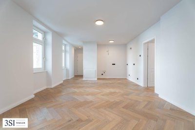 Stilvoll wohnen mit Grünblick – sanierter 2-Zimmer-Altbau mit Balkon in ruhiger Lage
