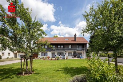 Großzügiges Dreifamilienhaus mit vielseitigen Nutzungsmöglichkeiten auf sonnigem Grundstück