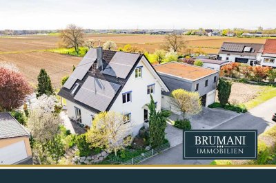 BRUMANI | Modernes Einfamilienhaus mit hochwertigem Anbau, Doppelgarage und Pool in Buggingen