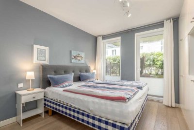 Erdgeschosswohnung auf einer Ebene in Strandlage mit Tiefgaragenstellplatz