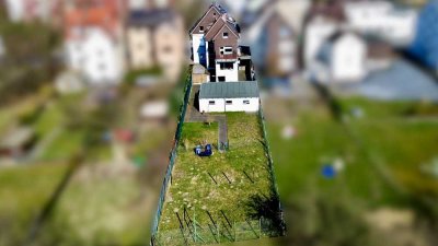 RESERVIERT! Arnsberg-Hüsten: Vermietetes 3-Familien-Haus mit Garagen und Garten