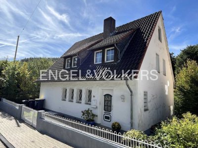 Charmantes Zuhause mit Baugrundstück in zentraler Lage