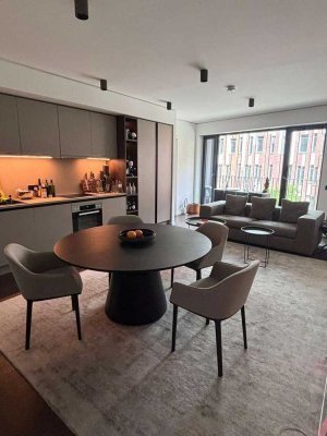 Vollmöblierte Design-Wohnung mit spannenden Blickachsen und Community-Features (Coworking, Fitness)