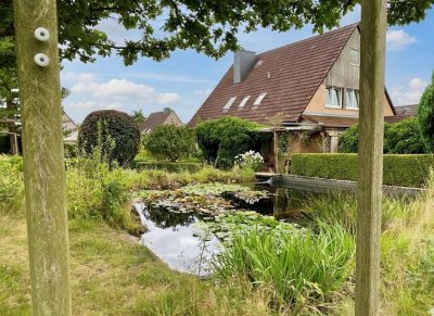 Idyllisch gelegenes Einfamilienhaus mit großem Gartenparadies und Teich