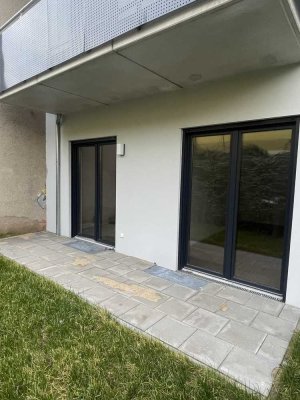 Moderne 2-Zimmer-Wohnung mit FBH, Terrasse + Garten + Parkplatz