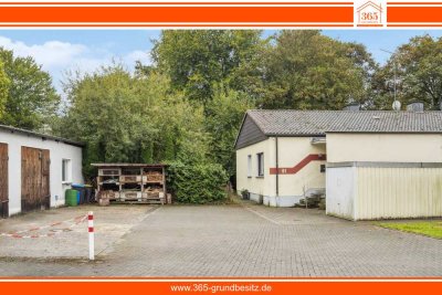 Charmantes Zweifamilienhaus mit großzügigem Garten und Lagerhalle