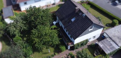 Einfamilienhaus mit Einliegerwohnung, Dachgeschoss und gepflegtem Garten in Linsengericht-Geislitz.