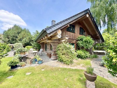 Grüner Luxus – Naturstammhaus mit eigenem Gartenparadies!