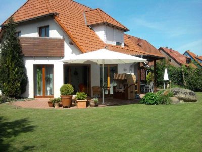 Exklusives Einfamilienhaus mit idyllischem Garten.