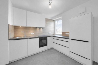 2-Zimmer-Dachgeschosswohnung mit Einbauküche, Balkon und Blick ins Grüne