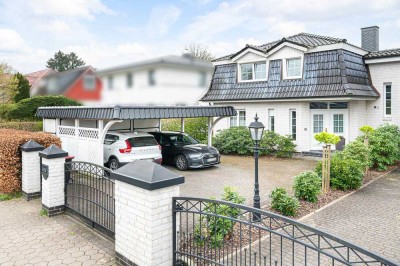 Gepflegte DHH mit Doppelcarport und wohnlich ausgebautem Keller!