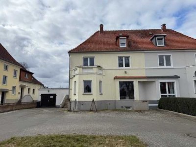 Sanierungsbedürftiges Mehrfamilienhaus in zentraler Lage