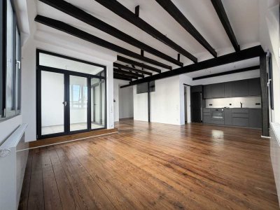 Penthouse mit Loggia in denkmalgeschützter Bandfabrik