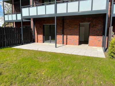 Neubau Erdgeschoss-Wohnung mit großer Terrasse, Garten, Carport und EBK in Bedburg-Hau