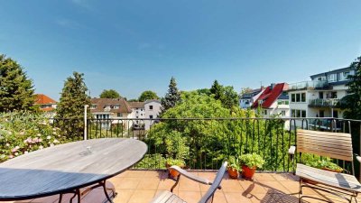Modernisierte Drei-Zimmer-Altbauwohnung mit Stuck, Balkon und Blick ins Grüne
