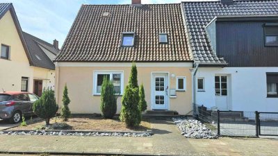 Charme der 30er trifft Familienkomfort – Doppelhaushälfte mit Charakter und Garten in Holtorf