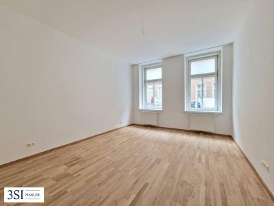 Charmante 1-Zimmer-Wohnung im klassischen Altbauparterre