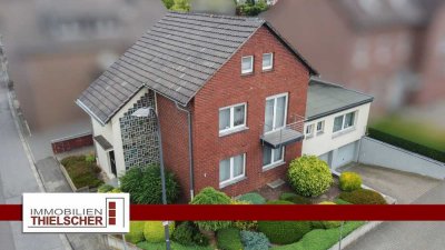 Großzügiges Zweifamilienhaus mit Balkon, Terrasse, Garten und 2 Tiefgaragen im idyllischen Loverich