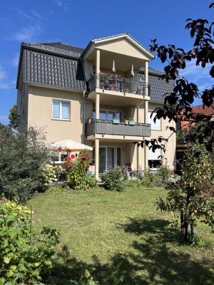 3,5 Zi Wohnung mit großer Südterasse und Gartenanteil