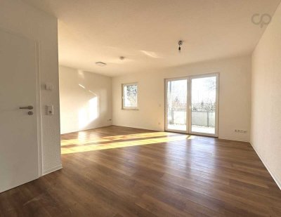 NEUBAU! LICHTDURCHFLUTETE 1-ZIMMERWHG. MIT EINBAUKÜCHE UND BALKON + PKW-STELLPLATZ
