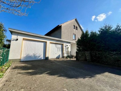 Wohnen mit Freiraum- Zweifamilienhaus mit Garten, Terrasse & Baugrundstück.