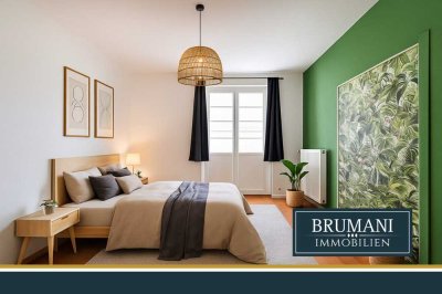 BRUMANI | Großzügige Altbauwohnung mit Echtholzdielen und zwei Balkonen in Toplage