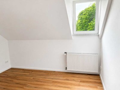 Großzügig sanierte 2 Zimmer Wohnung mit großer Wohnküche und Gartenblick
