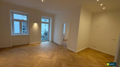 Elegante Altbauwohnung mit 7 m² Freifläche – hochwertiger Erstbezug.