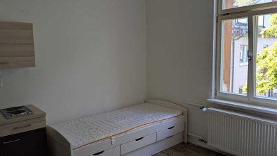 Möbliertes Zimmer in einer WG