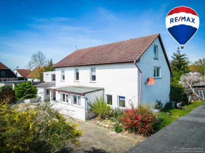 Geräumiges Einfamilienhaus mit Kaminofen, Garten und vielseitigen Nebengebäuden in ruhiger Lage