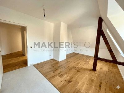 **Modernisierte 2-Zimmer-Dachgeschosswohnung mit offener Wohnküche & Fußbodenheizung**