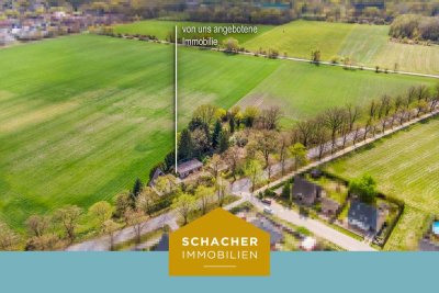 Einfamilienhaus mit großer Garage (ca. 85qm) auf einzigartigem Grundstück, umgeben von Feldern