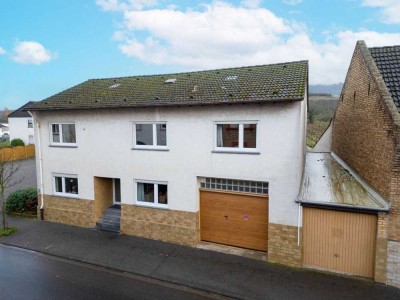 Platz, Sonne und Gestaltungsspielraum: Einfamilienhaus mit Garten, Garage und Terrassen in Ockenheim