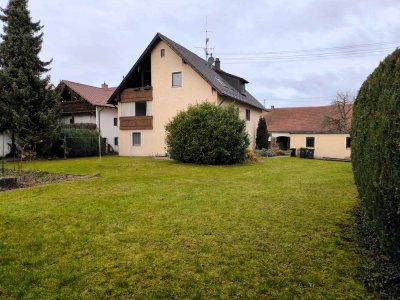 Großzügige Erdgeschosswohnung mit Garten und Garage