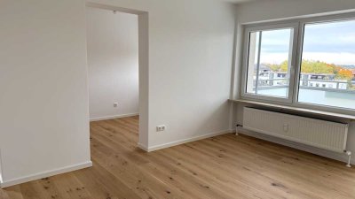 Erstbezug nach Renovierung: Möblierte 1,5-Zimmer-Wohnung mit Südbalkon und Alpenblick in Neufahrn.