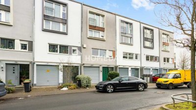 Ruhiges Wohnen zwischen City und Natur: stilvolles Townhouse mit Südterrasse, Balkon & Kamin