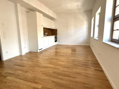 Erstbezug in bester Lage – 1-Raum-Wohnung mit EBK, Fußbodenheizung und Duschbad