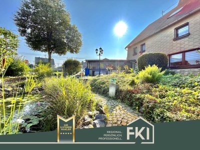 **Gepflegte Doppelhaushälfte mit toller Gartenanlage und gräumigen Garagen in Dreisbach**
