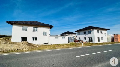 Neue Einfamilienhäuser in Weidenholz
