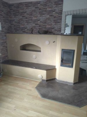 Ebenerdiges Bungalow-Reiheneinfamilienhaus in Hannover-Groß-Buchholz mit effizienten Grundofen