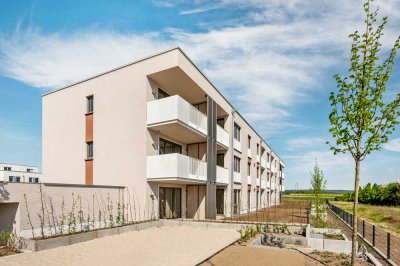 Neubau-Erstbezug! Wohnung mit großem Balkon, TG-Stellplatz und Einbauküche in direkter Feldrandlage