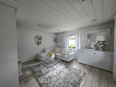 Zweifamilienhaus mit Doppelgarage, Wellnessbereich und liebevoll gestaltetem Garten