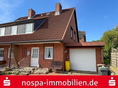 Teilweise unterkellertes Reihenendhaus mit Garage und Terrasse im beliebten Stadtteil Rödemis