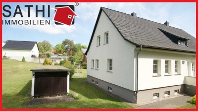 Gepflegte Doppelhaushälfte mit Vollkeller und Garage auf grünem Grundstück!